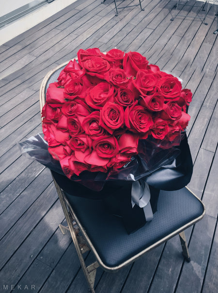 Eternal Noir 99 bouquet of ninety-nine red roses in black wrapping