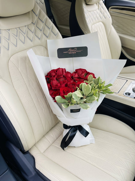 Éloise Pearl bouquet of twenty-four red roses in ivory and pearl wrapping