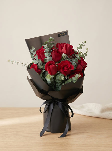 Aurelia Noir bouquet of twelve red roses in black wrapping