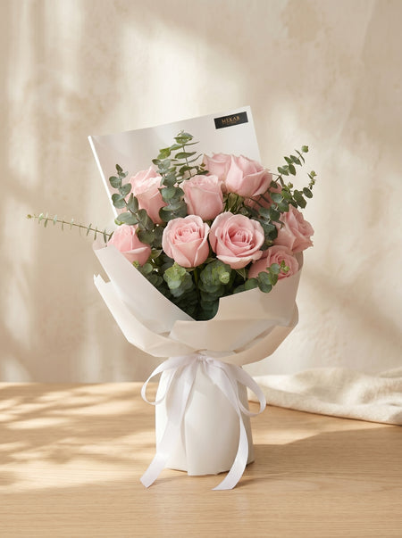 Aurelia Blush bouquet of twelve pink roses in blush wrapping