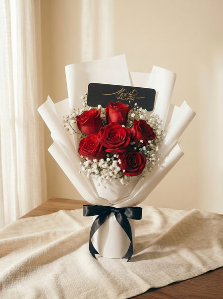 Celeste Ivory bouquet of six red roses with white baby's breath