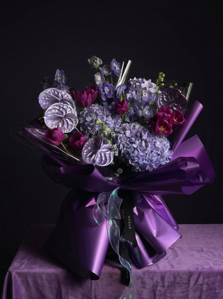 Ratu bouquet in electric purple and deep magenta with metallic violet wrap