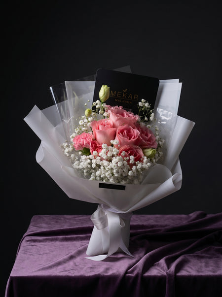Seri compact bouquet in vibrant pink with airy white fillers